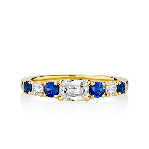 East/ West Prong Set Cushion Diamond Flanked by Alternating Blue Sapphire's and Diamonds