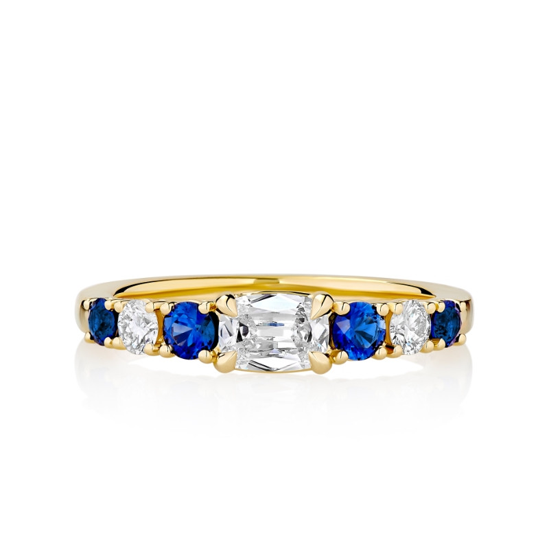 East/ West Prong Set Cushion Diamond Flanked by Alternating Blue Sapphire's and Diamonds